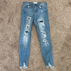 Ripped light wash jeans with holes